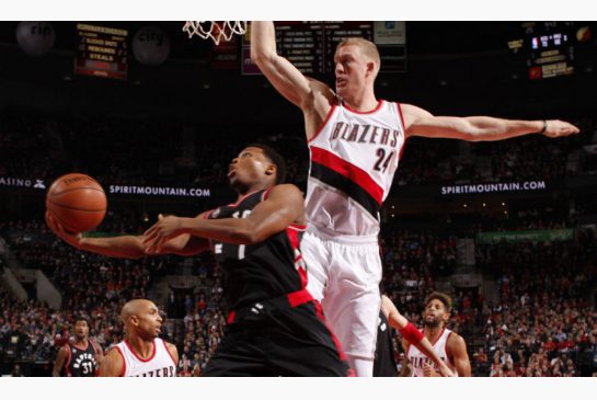 Raptor Kyle Lowry looks for a way around Mason Plumlee of the Blazers in Thursday night’s action in Portland