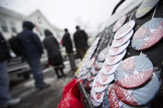 Snow collects on buttons for sale outside a campaign event for Republican presidential candidate Donald Trump at the Londonderry Lions Club Monday Feb. 8 2016 in Londonderry N.H