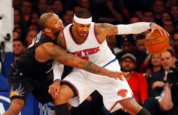 Knicks Carmelo Anthony controls the ball against P.J