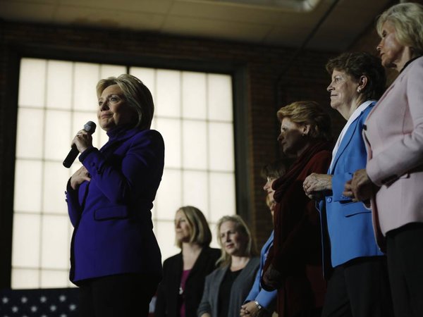 Democratic presidential candidate Hillary Clinton accompanied by from right Lilly Ledbetter right Sen. Jeanne Shaheen D-N.H. Sen. Debbie Stabenow D-Mich. Sen. Amy Klobuchar D-Minn. and others speaks during a campaign stop Friday Feb. 5 2016