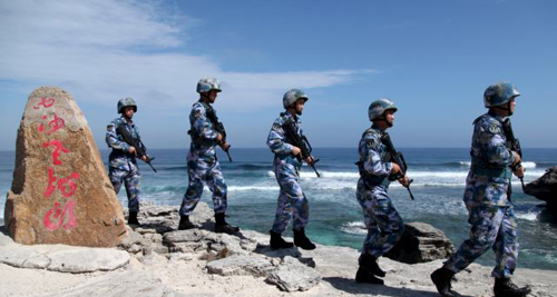 Soldiers of Chinas Peoples Liberation Army Navy patrol at Woody Island in the Paracel Archipelago which is known in China as the Xisha Islands on Jan. 29 2016. /Reuters