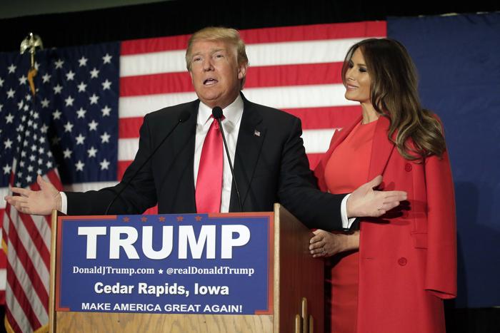 CEDAR RAPIDS IA- FEBRUARY 1: Republican presidential candidate Donald Trump speaks with his wife Melania Trump by his side during a campaign event at the U.S. Cellular Convention Center February1 2016 in Cedar Rapids Iowa. Trump who is seeking the