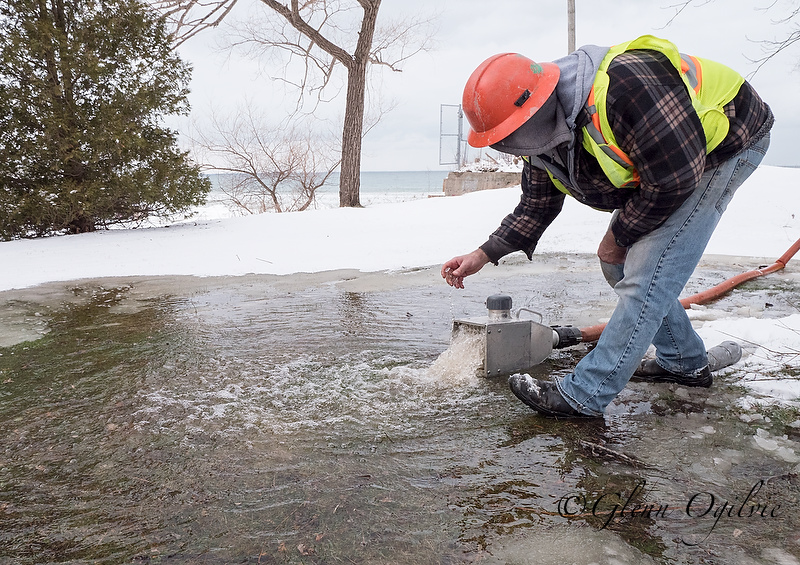 City of Sarnia worker Alex Scheibner collects a water sample while flushing a hydrant to test it for chlorine.
Glenn Ogilvie