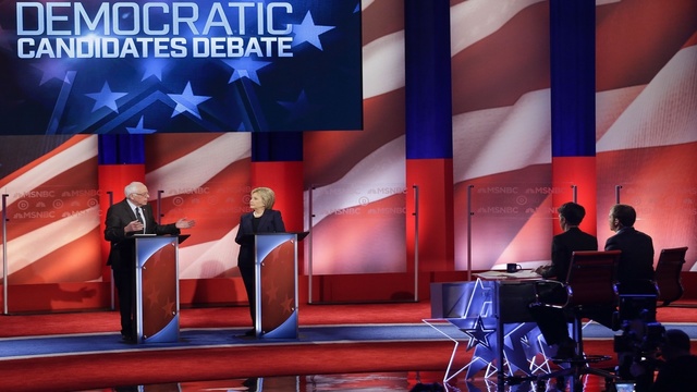 Debate moderators Rachel Maddow and Chuck Todd listen as Democratic presidential candidates Sen. Bernie Sanders I-Vt and former Secretary of State Hillary Clinton answer questions during the Feb. 4th debate