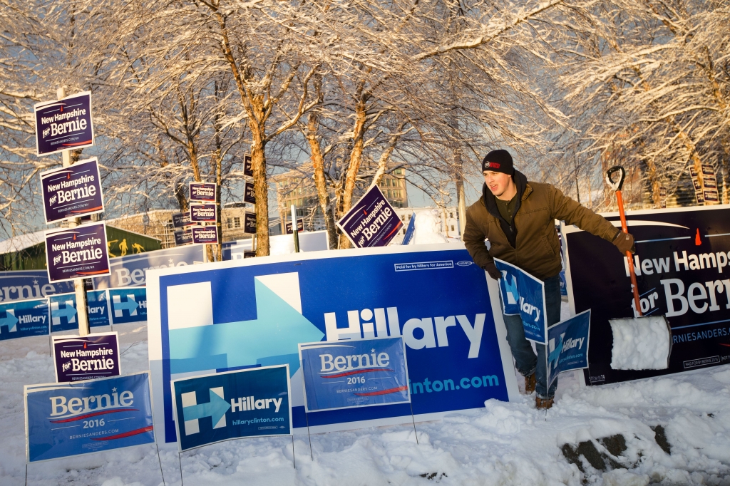 DEM 2016 Clinton_WEB A campaign staffer for Democratic presidential candidate Hillary Clinton adjusts signs outside the Verizon Wireless Center before the 2016 Mc Intyre Shaheen 100 Club Celebration on Friday in Manchester N.H