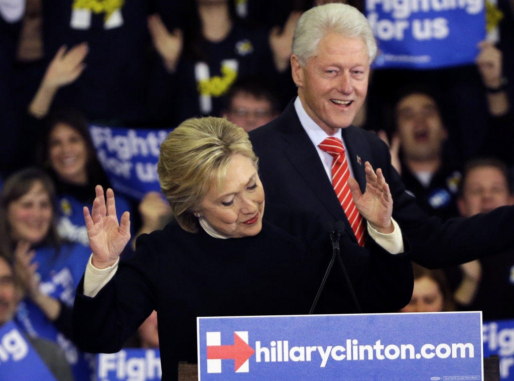 Democratic presidential candidate Hillary Clinton reacts as former President Bill Clinton smiles at a presidential primary campaign rally in Hooksett N.H