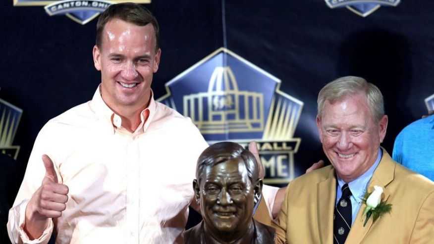 Aug 8 2015 Canton OH USA Denver Broncos quarterback Peyton Manning and Bill Polian pose with the bust at the 2015 Pro Football Enshrinement Cermony at Tom Benson Hall of Fame Stadium. Mandatory Credit Andrew Weber-USA TODAY Sports