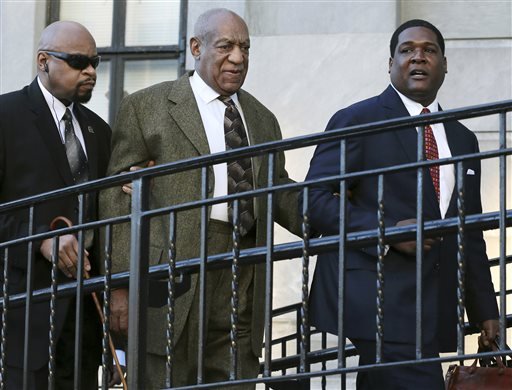 Actor and comedian Bill Cosby center arrives for a court appearance Tuesday Feb. 2 2016 in Norristown Pa. Cosby was arrested and charged with drugging and sexually assaulting a woman at his home in January 2004