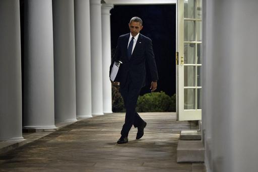 President Obama walks from the West Wing to the residence of the White House with a binder of potential Supreme Court nominees in Washington Feb. 19 2016