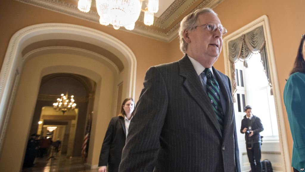 Senate Majority Leader Mitch Mc Connell walks to the chamber where he offered a tribute to the late Supreme Court Justice Antonin Scalia on Capitol Hill in Washington Feb. 22 2016