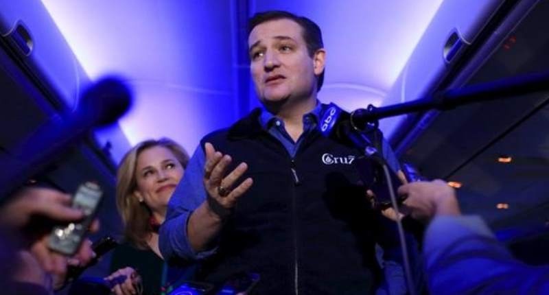 Republican presidential candidate Ted Cruz and his wife Heidi speak to the press aboard a plane en route to a campaign event in Piedmont South Carolina on Feb. 2 2016