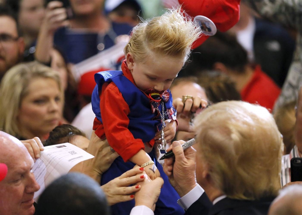 Image Republican U.S. presidential candidate Donald Trump signs the arm of 19-month-old Curtis Ray Jeffery II after a rally in Baton Rouge Louisiana