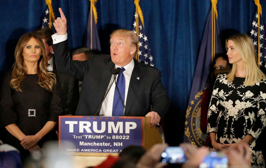 Republican presidential candidate businessman Donald Trump speaks to supporters during a primary night rally Tuesday Feb. 9 2016 in Manchester N.H. At his side are his wife Melania Trump left and daughter Ivanka Trump right