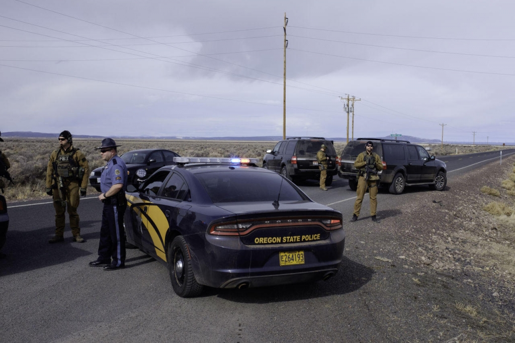 The FBI and Oregon State Police temporarily close a stretch of road near the Malheur Wildlife Refuge Headquarters near Burns Oregon