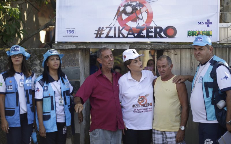 Brazil's President Dilma Rousseff talks with residents after leaving their house during a visit to their neighborhood on the National Day of Mobilization Zika Zero in Rio de Janeiro Brazil