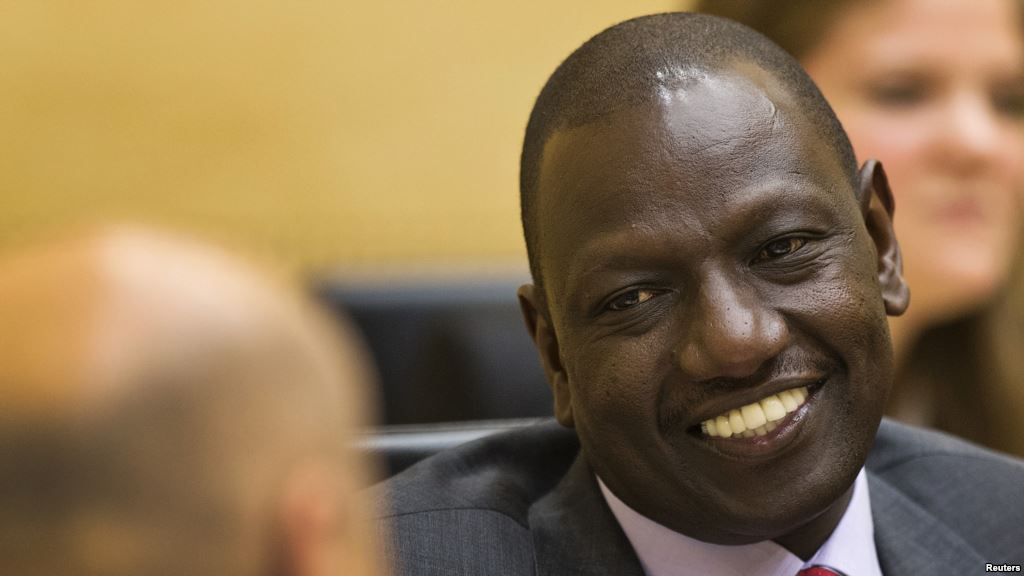 FILE- Kenyan Deputy President William Ruto speaks to his attorney at the International Criminal Court in The Hague Sept. 10 2013