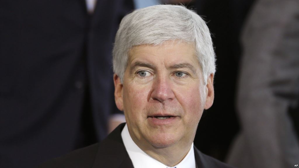 FILE- Michigan Gov. Rick Snyder speaks in Detroit. Snyder is under fire accused of reacting too slowly to the water crisis in Flint