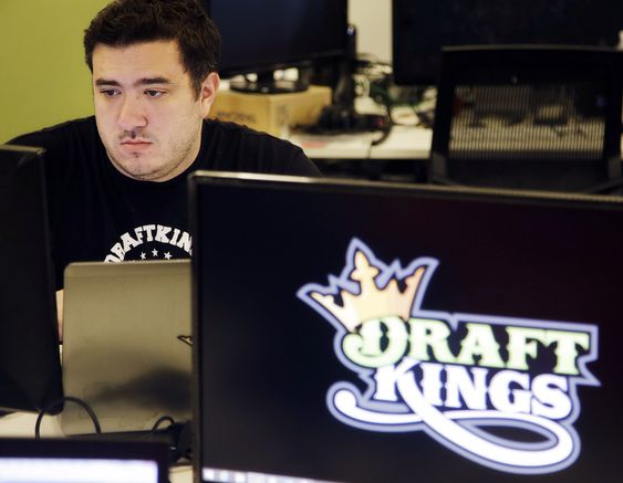 Len Don Diego marketing manager for content at the Draft Kings daily fantasy sports company works at his station at the company's offices in Boston. Daily fantasy sports companies have said their industry