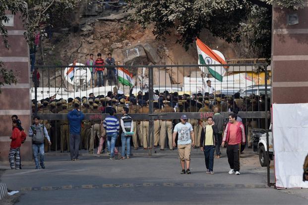 Police personnel at the entrance of JNU as students agitate for the release of the Students Union president Kanhaiya Kumar at the Jawaharlal Nehru University in New Delhi on Monday