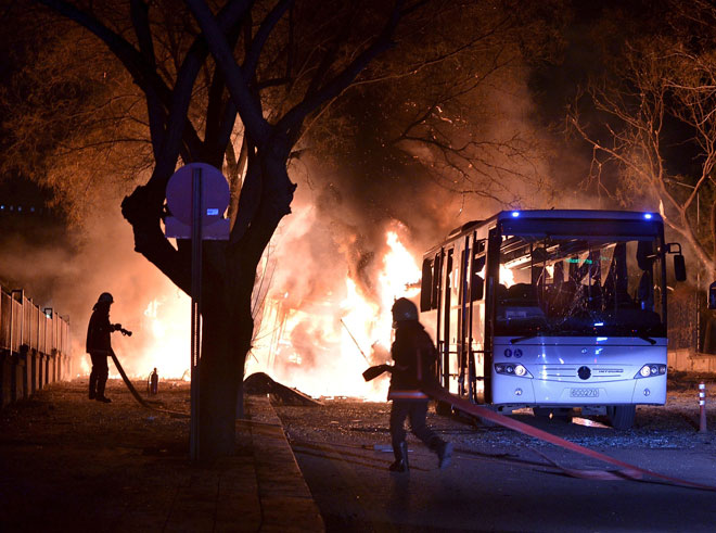 Firefighters prepare to extinguish fire after an explosion in Ankara Turkey. — Reuters