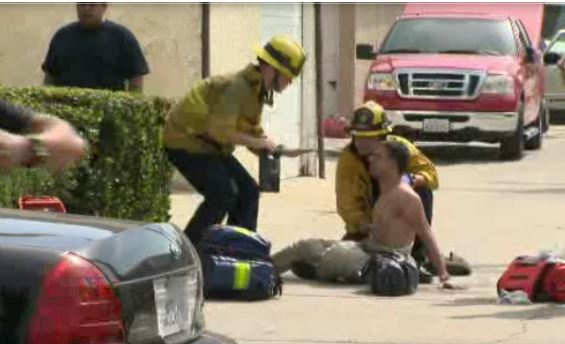 First responders treat an injured person at a Ku Klux Klan rally and counter-protest Saturday Feb. 27 2016 in Anaheim California. CBS LOS ANGELES