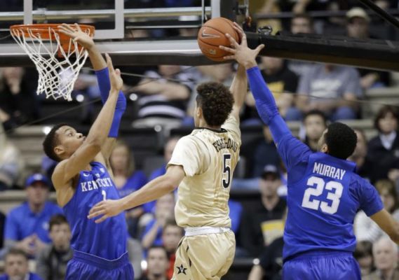 Vanderbilt guard Matthew Fisher Davis drives between Kentucky's