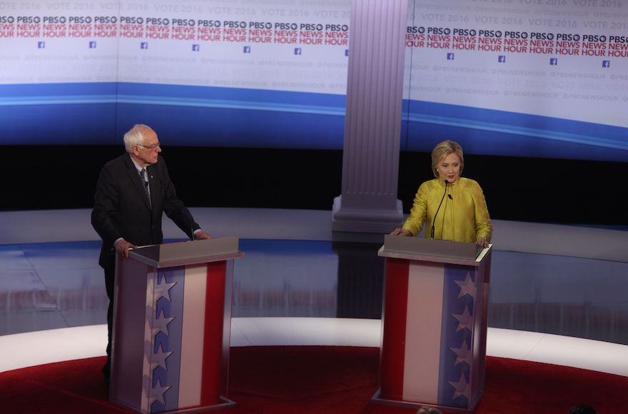 Hillary Clinton and Bernie Sanders participating in the PBS News Hour Presidential Primary Debate in Milwaukee Wisconsin Feb. 11 2016