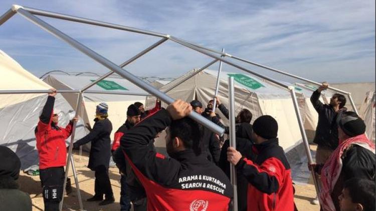 IHH Humanitarian Relief Foundation setting up tents for Syrian refugees