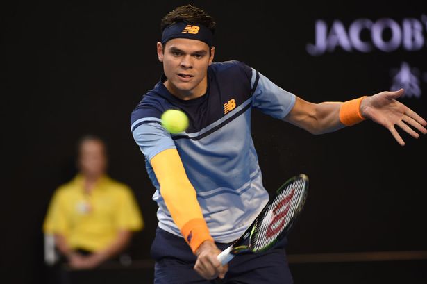 Canada's Milos Raonic plays a backhand return during his men's singles semi-final match against Britain's Andy Murray