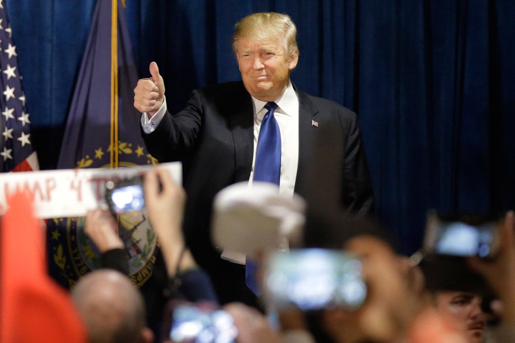 Celebrating his victory in the Republican primary Donald Trump greets supporters at a primary night rally in Manchester N.H