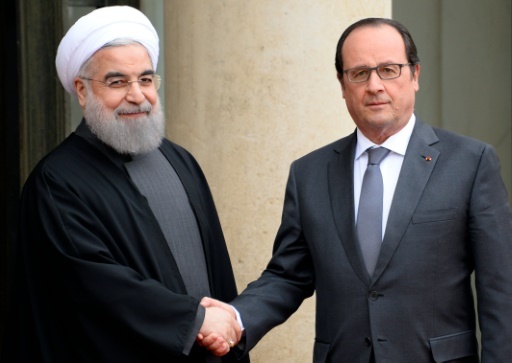 Hollande reminds Iran president of France s commitment to human rights