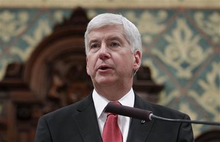 Michigan Gov. Rick Snyder delivers his State of the State address to a joint session of the House and Senate at the state Capitol in Lansing Mich. Snyder has released some but not all of his government ema