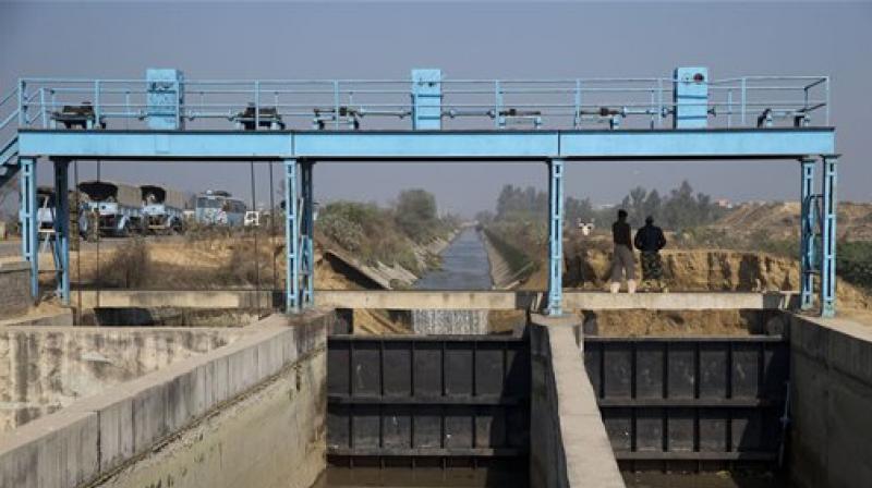 Indian military guard the Munak canal near the village of Bindroli