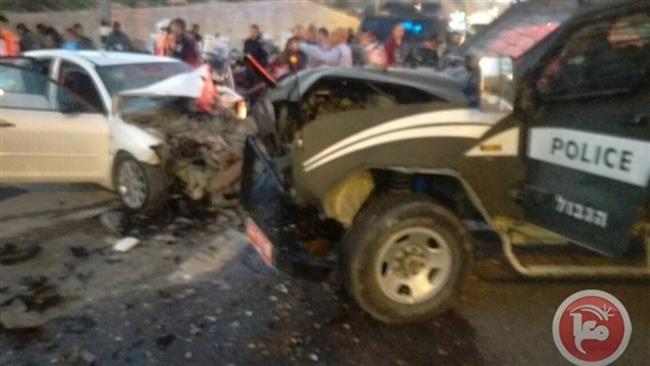 People gather at the site of an incident involving a Palestinian vehicle that reportedly ran into an Israeli police jeep in East al Quds