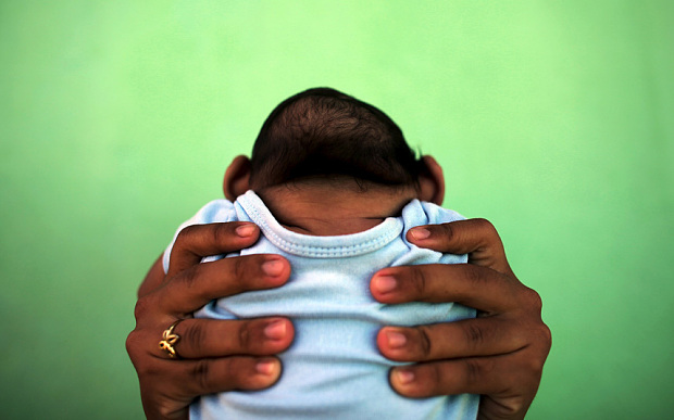 Jackeline 26 holds her 4-month old son who was born with microcephaly in Olinda near Recife Brazil