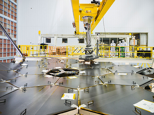 Inside a massive cleanroom at NASA's Goddard Space Flight Center in Greenbelt Maryland the James Webb Space Telescope team used a robotic am to install the last of the telescope's 18 mirrors onto the telescope structure. Image NASA  Chris Gunn