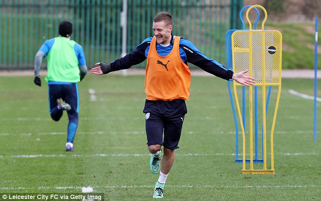 Jamie Vardy laughs as he trains alongside his Leicester City team-mates ahead of their game with Norwich