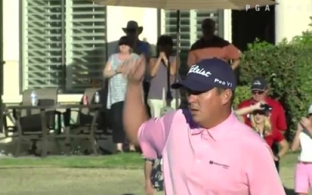 Jason Dufner nearly chips in from the rocks