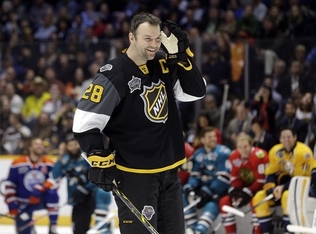 John Scott listens to the cheers as he gets ready to compete in the hardest shot competition at the NHL hockey All Star game skills competition Saturday Jan. 30 2016 in Nashville Tenn. Scott was elected as captain of the Pacific Division while