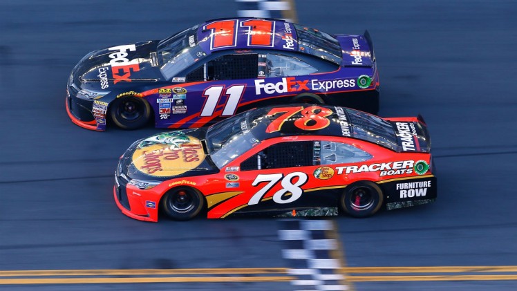 Jonathan Ferrey  Getty Images Denny Hamlin takes the chequered flag ahead of Martin Truex Jr