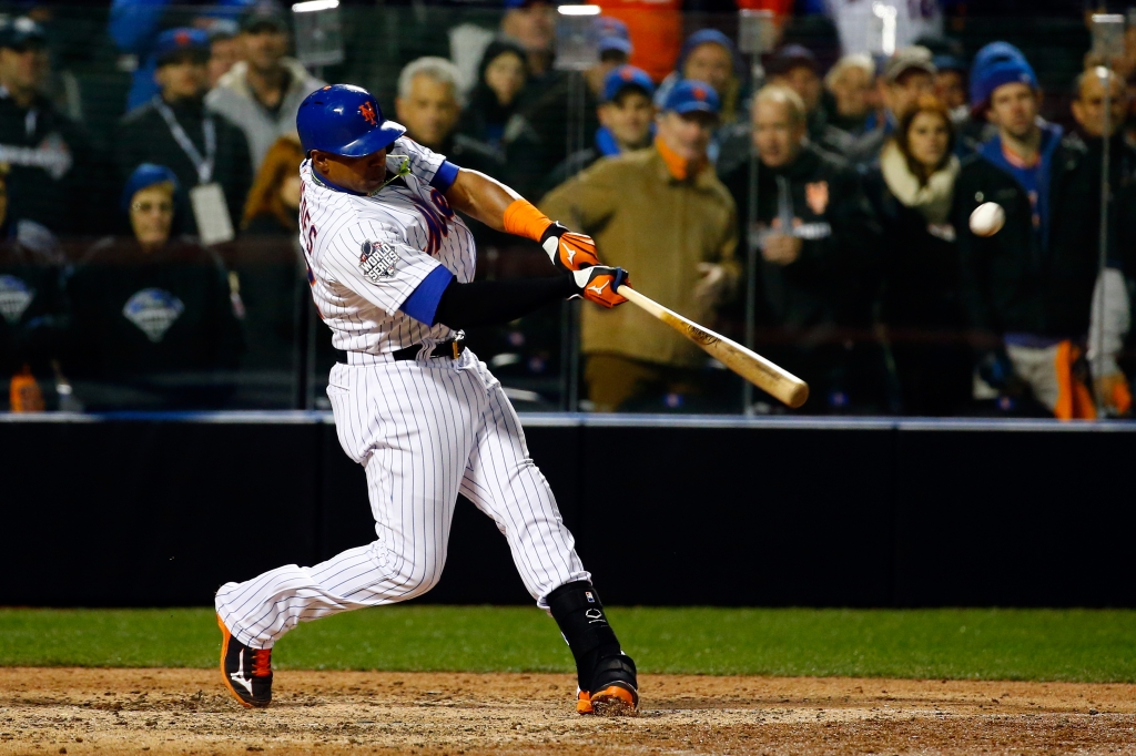 NEW YORK NY- OCTOBER 30 Juan Uribe #2 of the New York Mets hits an RBI single in the sixth inning against the Kansas City Royals during Game Three of the 2015 World Series at Citi Field