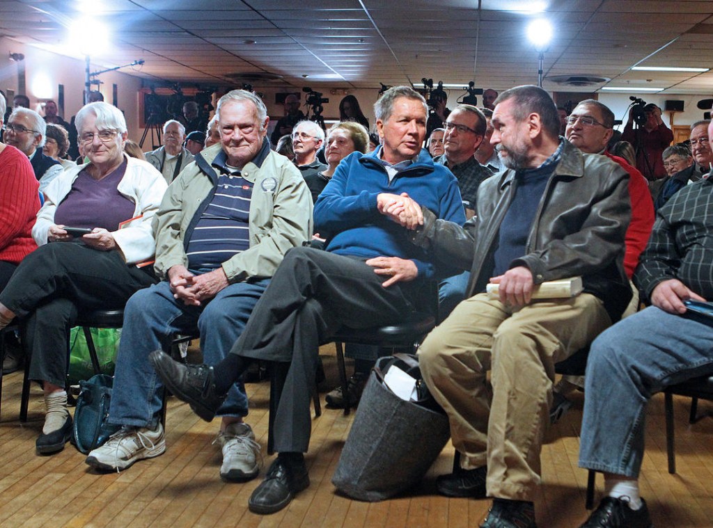 Nancy Lane   SHAKE ON IT Republican candidate John Kasich center greets audience members at a town hall event in Salem N.H. yesterday