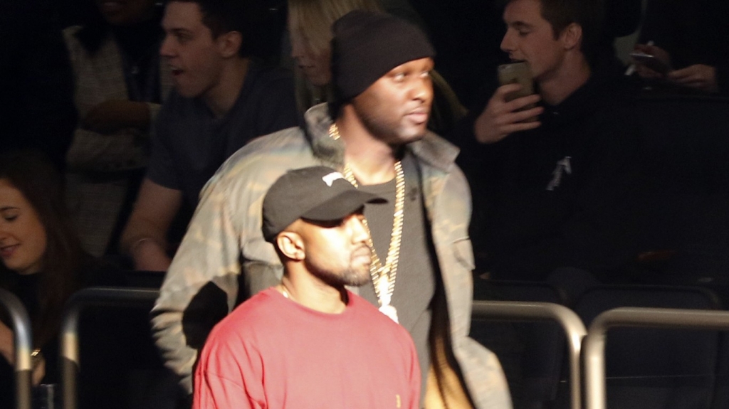 Lamar Odom makes his first public appearance since brothel overdose at Kanye West's fashion show