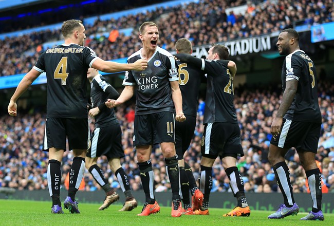 Leicester City's Marc Albrighton centre celebrates after Robert Huth scores his side's third goal of the game during the English Premier League soccer match at the Etihad Stadium Manchester England Saturday Feb. 6 2016. UN