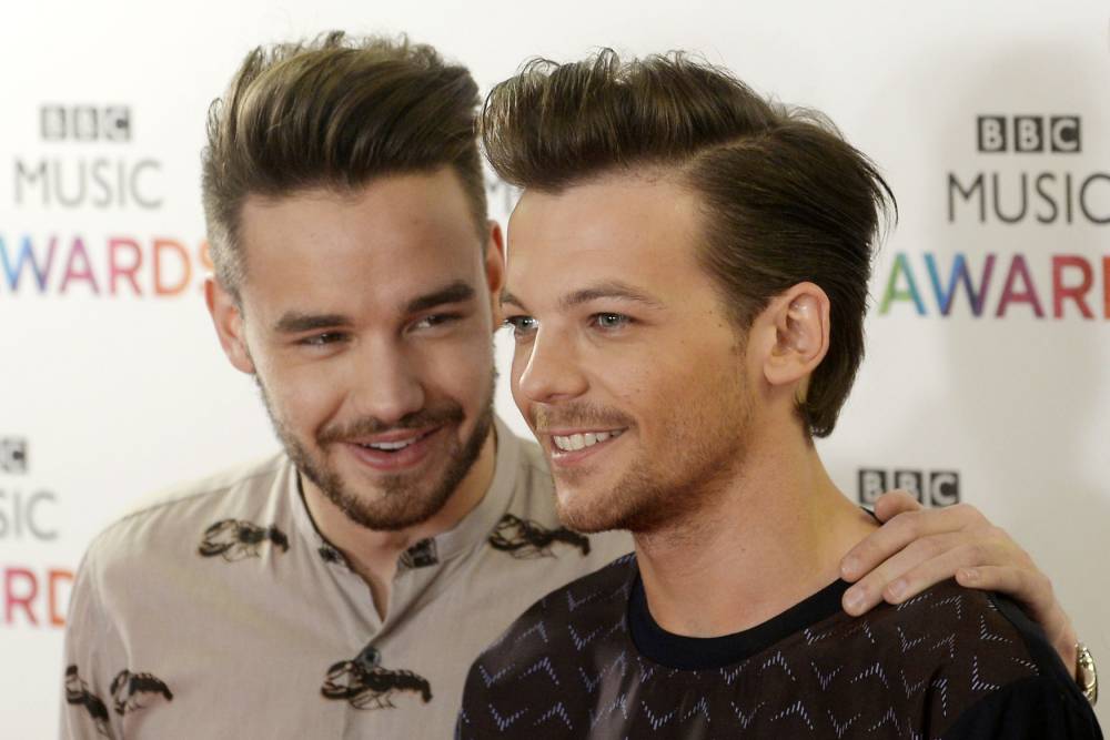 Liam Payne and Louis Tomlinson of One Direction arrive on the red carpet for the BBC Music Awards at the Genting Arena Birmingham. PRESS ASSOCIATION