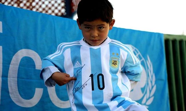 'Carrier bag kid' Ahmadi receives signed Messi shirt