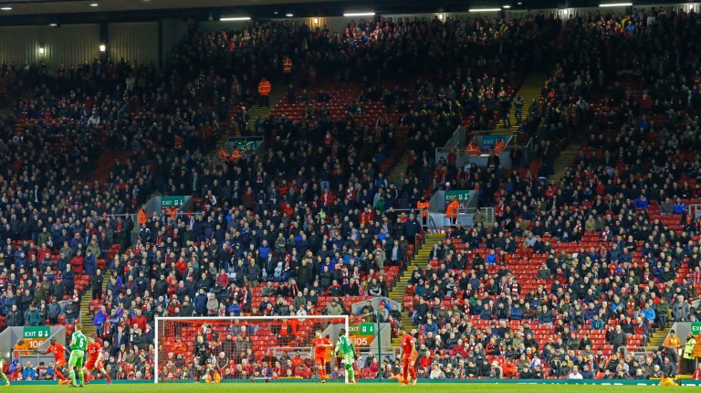 AFP  File  Lindsey Parnaby Liverpool fans leave the stands at the Kop End after 77 minutes&#039 of play during the English Premier League football match between Liverpool and Sunderland at Anfield in Liverpool England