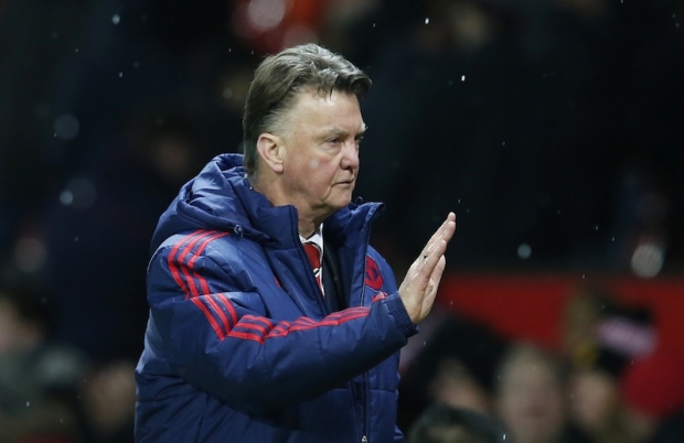 Manchester United manager Louis van Gaal waves to fans after the Manchester United v Stoke City Barclays Premier League match at Old Trafford. — Reuters pic