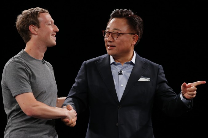 DJ Koh President of Mobile Communications Business Samsung Electronics shakes hands with Facebook CEO Mark Zuckerberg during the Samsung Galaxy Unpacked 2016 event on the eve of this week’s Mobile World Congress wireless show in Barcelona Spain