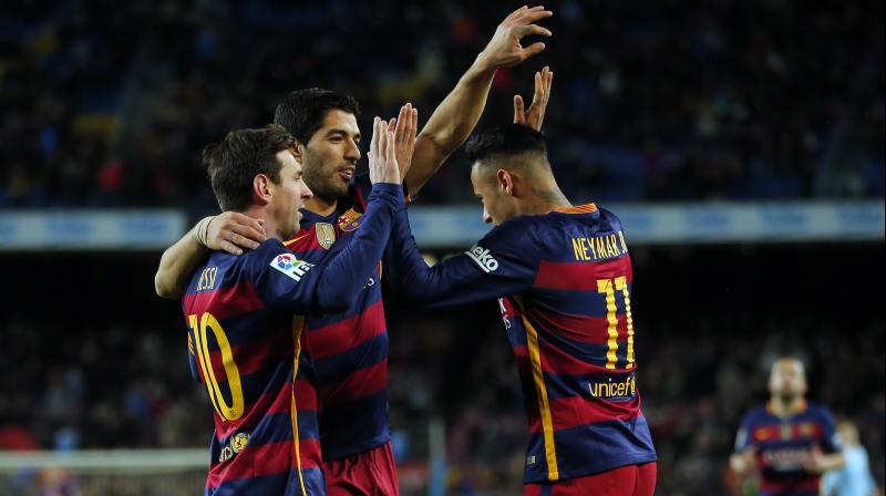 FC Barcelona's Neymar right celebrates a goal with his teammates Luis Suarez center and Lionel Messi against Celta Vigo during a Spanish La Liga soccer match at the Camp Nou stadium in Barcelona Spain Sunday Feb. 14 2016